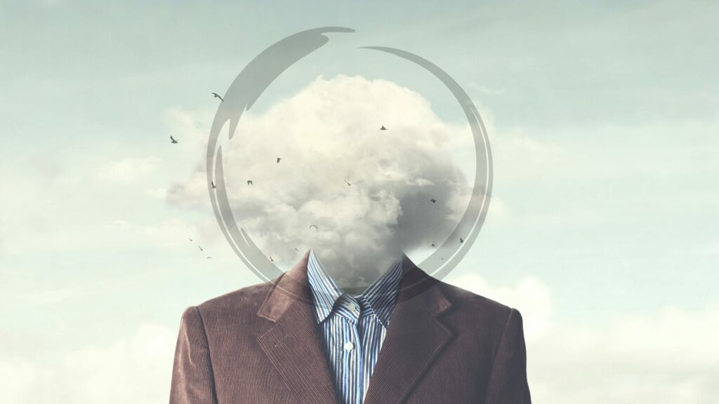 Homme dont la tête est enveloppée dans un brouillard symbolisant le brouillard mental et la charge mentale, un état souvent lié au stress que LaserAddict aide à apaiser.